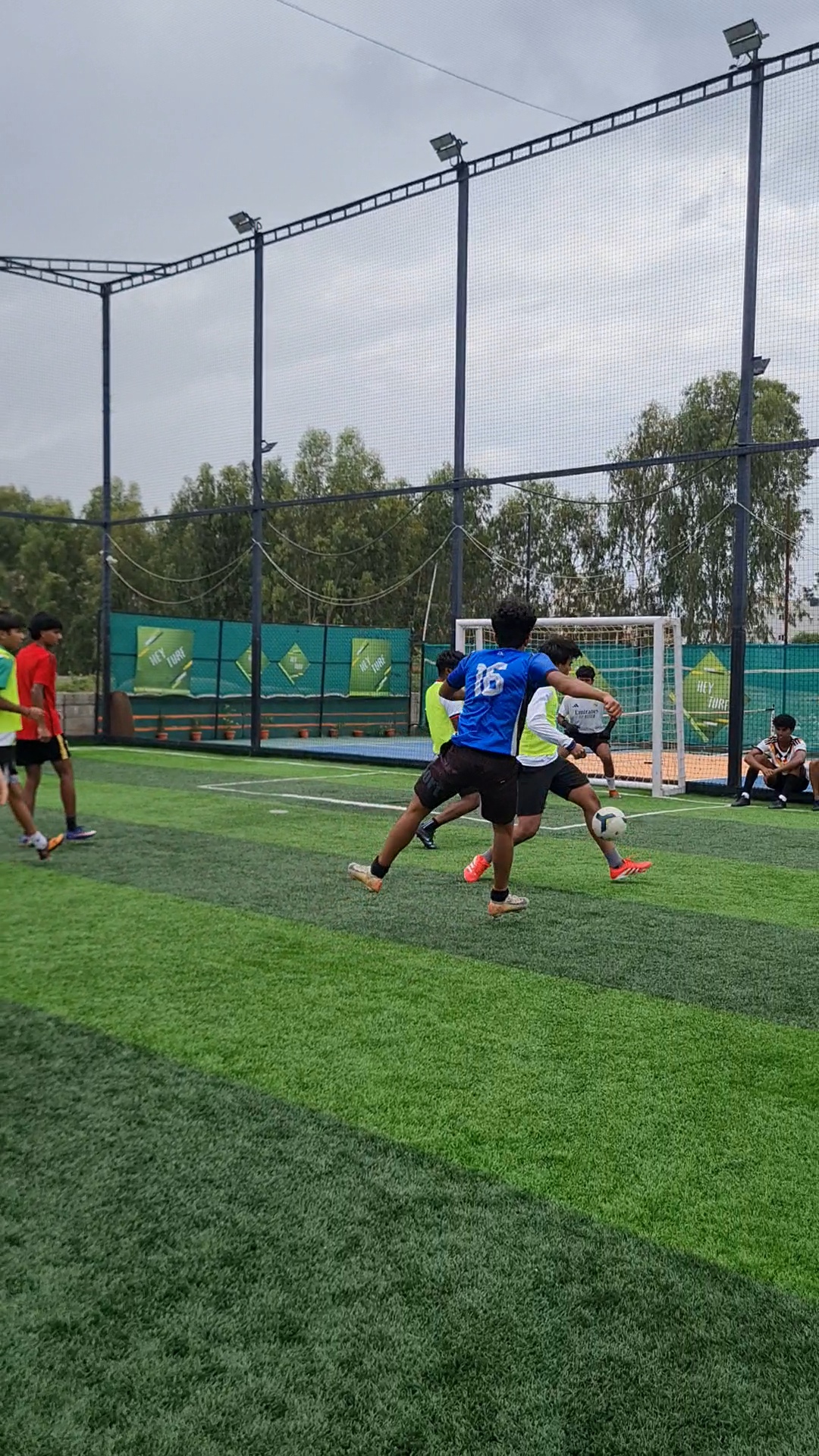 Attacker drives at the defence near the box at Hey Turf, Sarjapur